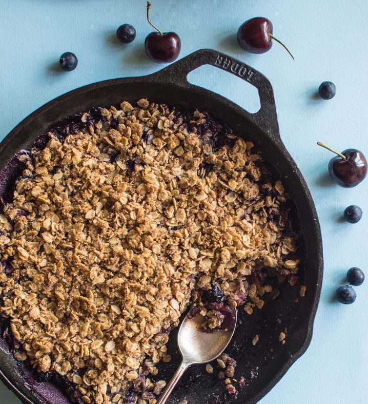 vegan peach cherry blueberry crumble via healthy nibbles and bits