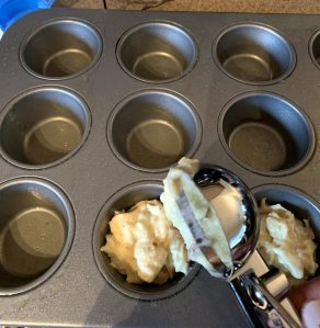 filling muffin pan